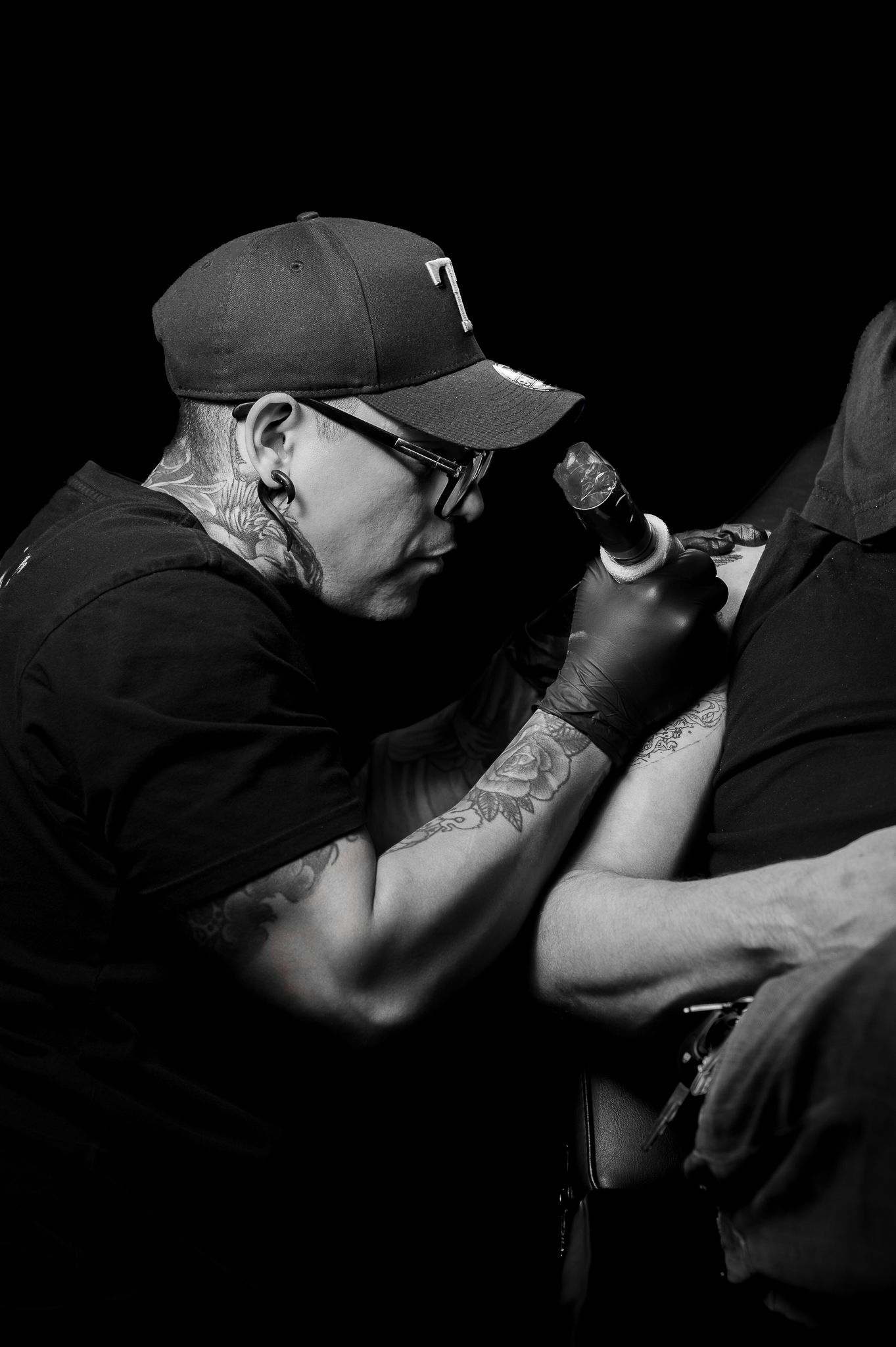 Artistic black and white series of someone taking photographs with professional camera equipment.