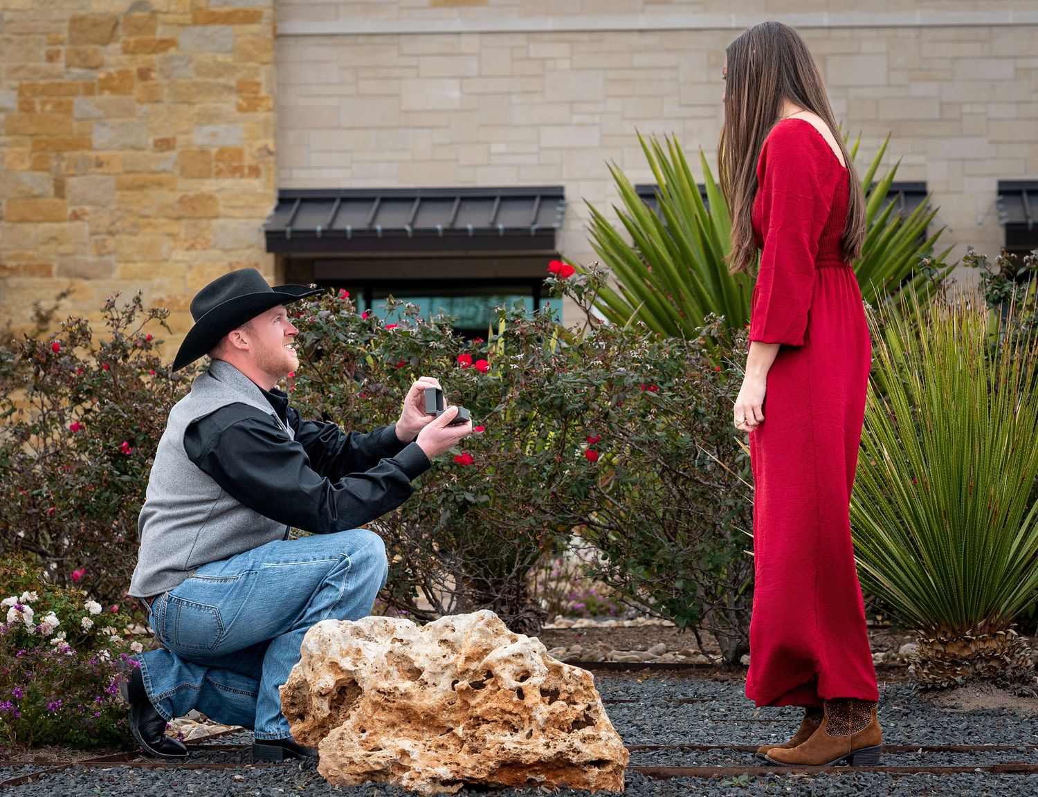 A sequence of proposal photos captured against a stone wall with landscaping.