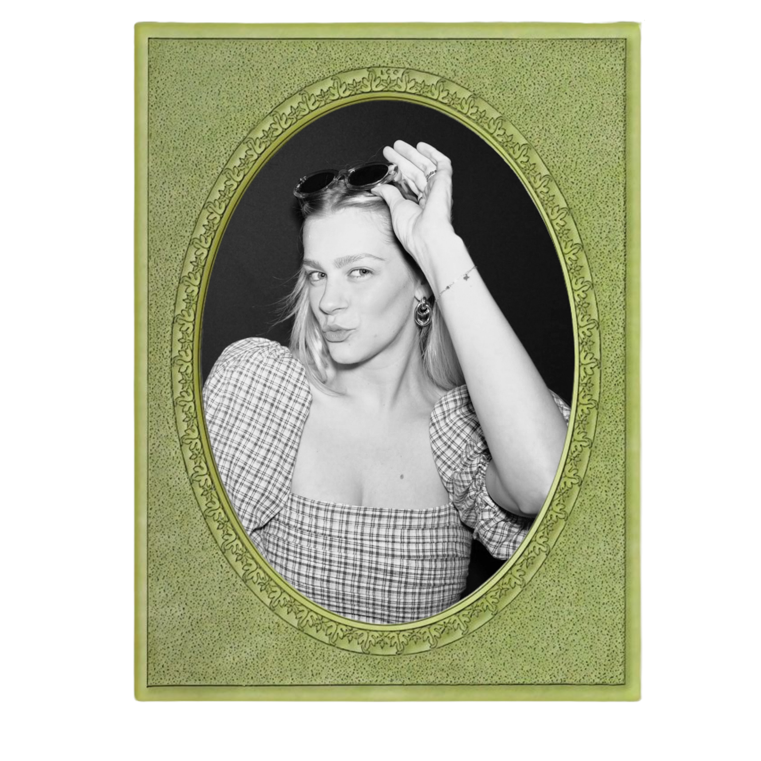 Black and white photo of a woman in a plaid top, displayed in an ornate green velvet oval picture frame.