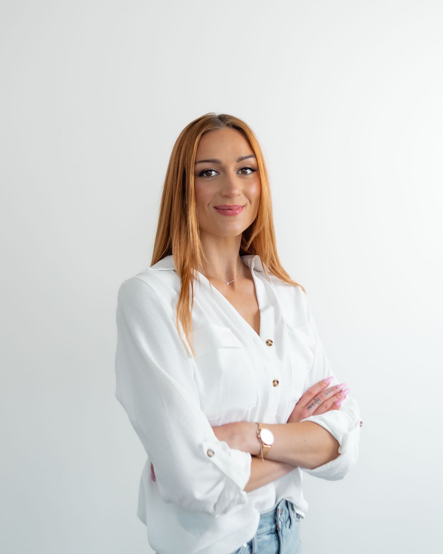 Professional headshots of a person in a white button-down shirt against a white background.