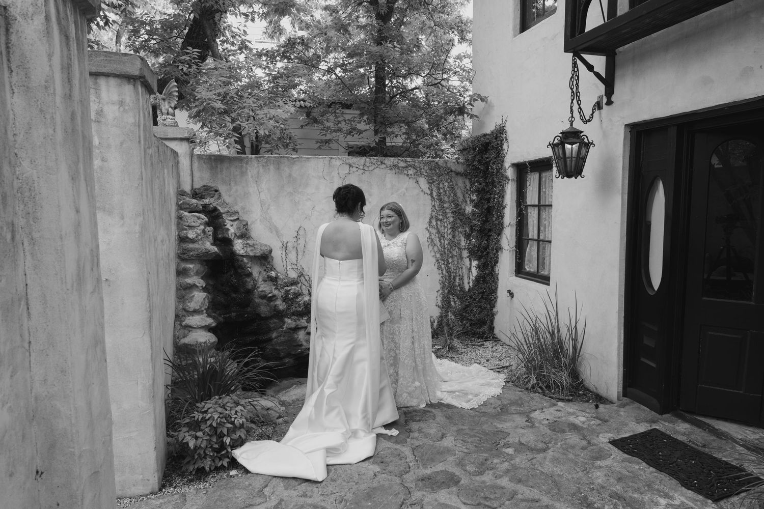 A series of black and white wedding photos showing romantic moments between newlyweds in an outdoor setting.