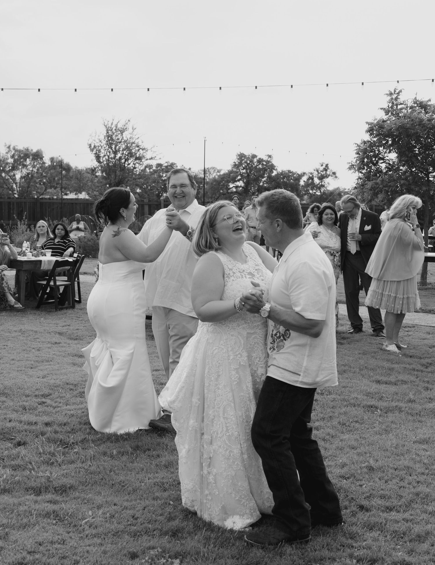 A sequence of black and white photos showing couples dancing together at an outdoor wedding reception.