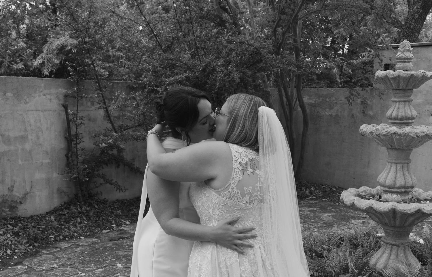 A romantic outdoor wedding photoshoot sequence showing intimate moments between the couple in a garden setting.