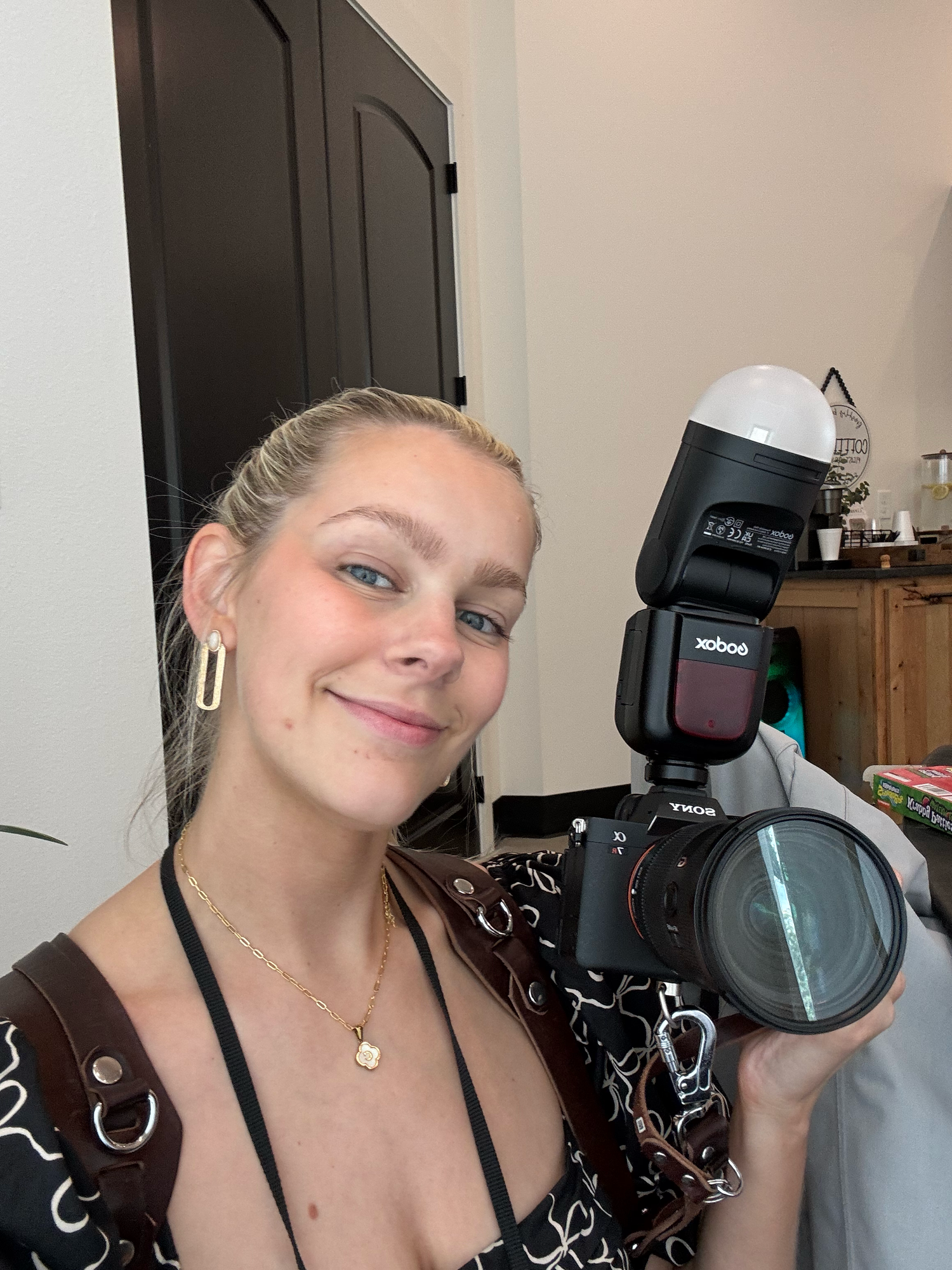 A person poses with photography equipment and flash units in a series of selfie-style shots.