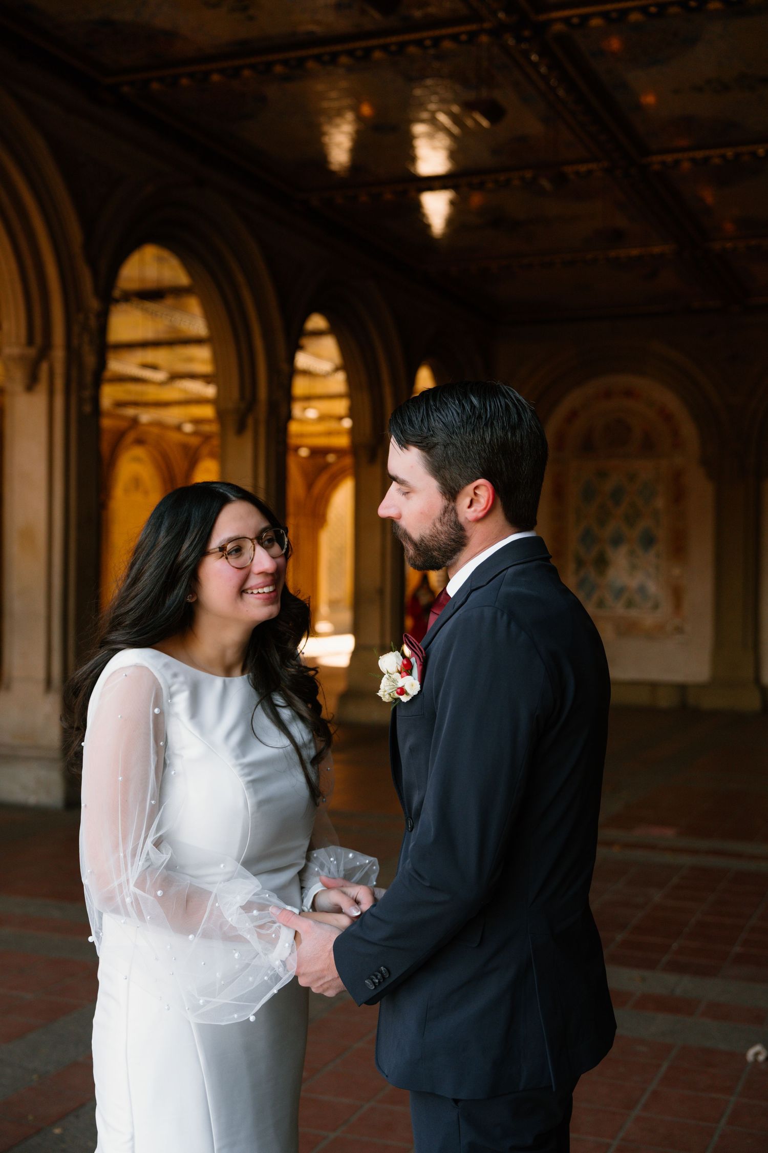 A romantic wedding sequence showing a couple sharing intimate moments under ornate architectural arches.