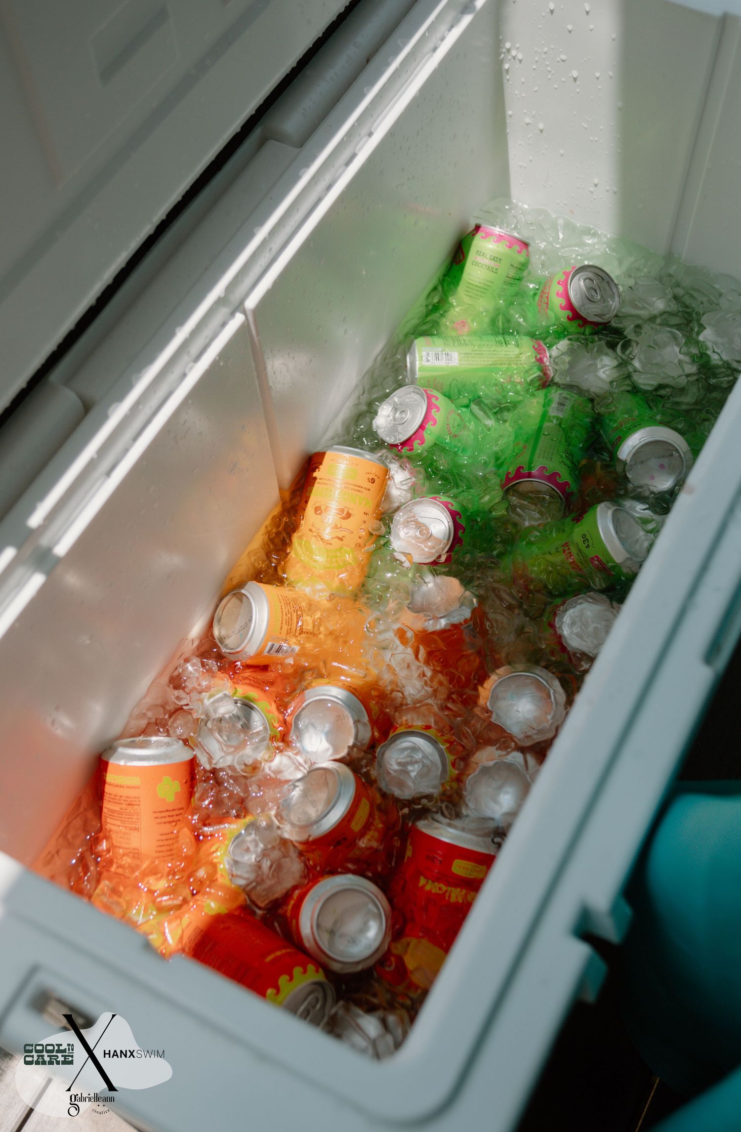Cooler filled with colorful drinks and ice showing organized beverage storage.