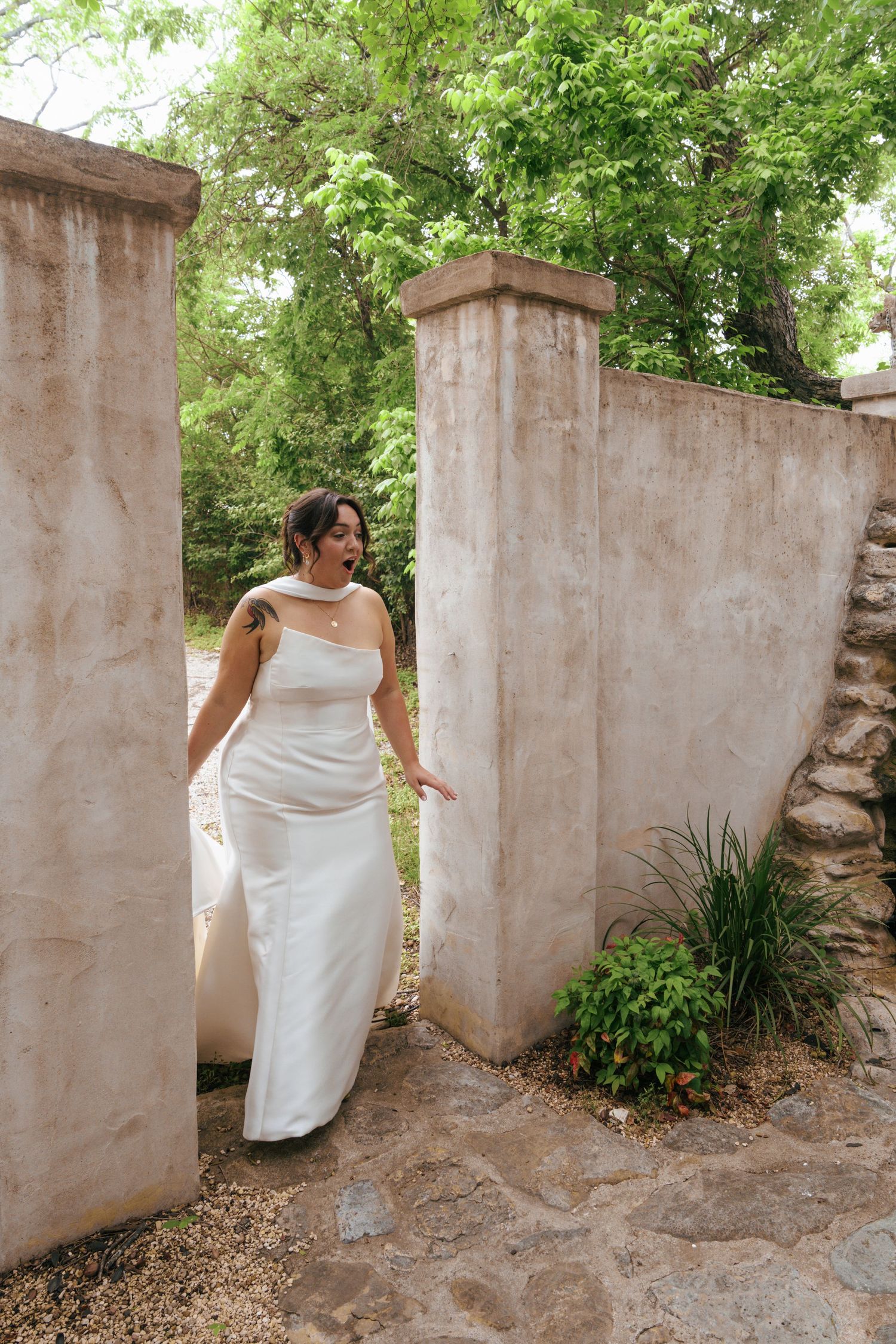 A sequence of three photos showing a person in a white dress moving between stone pillars in a garden setting.