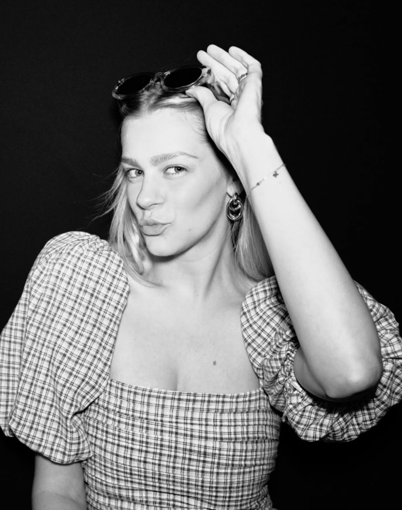 Black and white artistic portraits featuring someone in a plaid patterned dress.