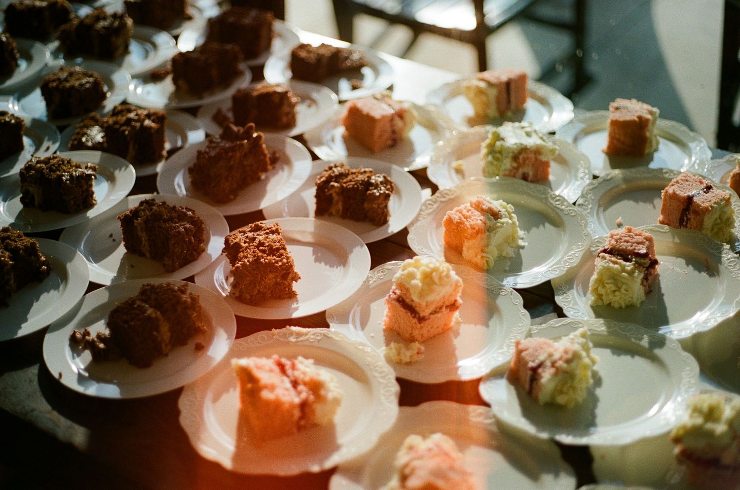 Elegant display of sushi and appetizers on white circular plates.