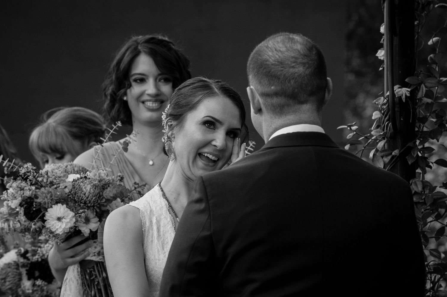 Black and white wedding photo sequence showing couple's first look reactions.