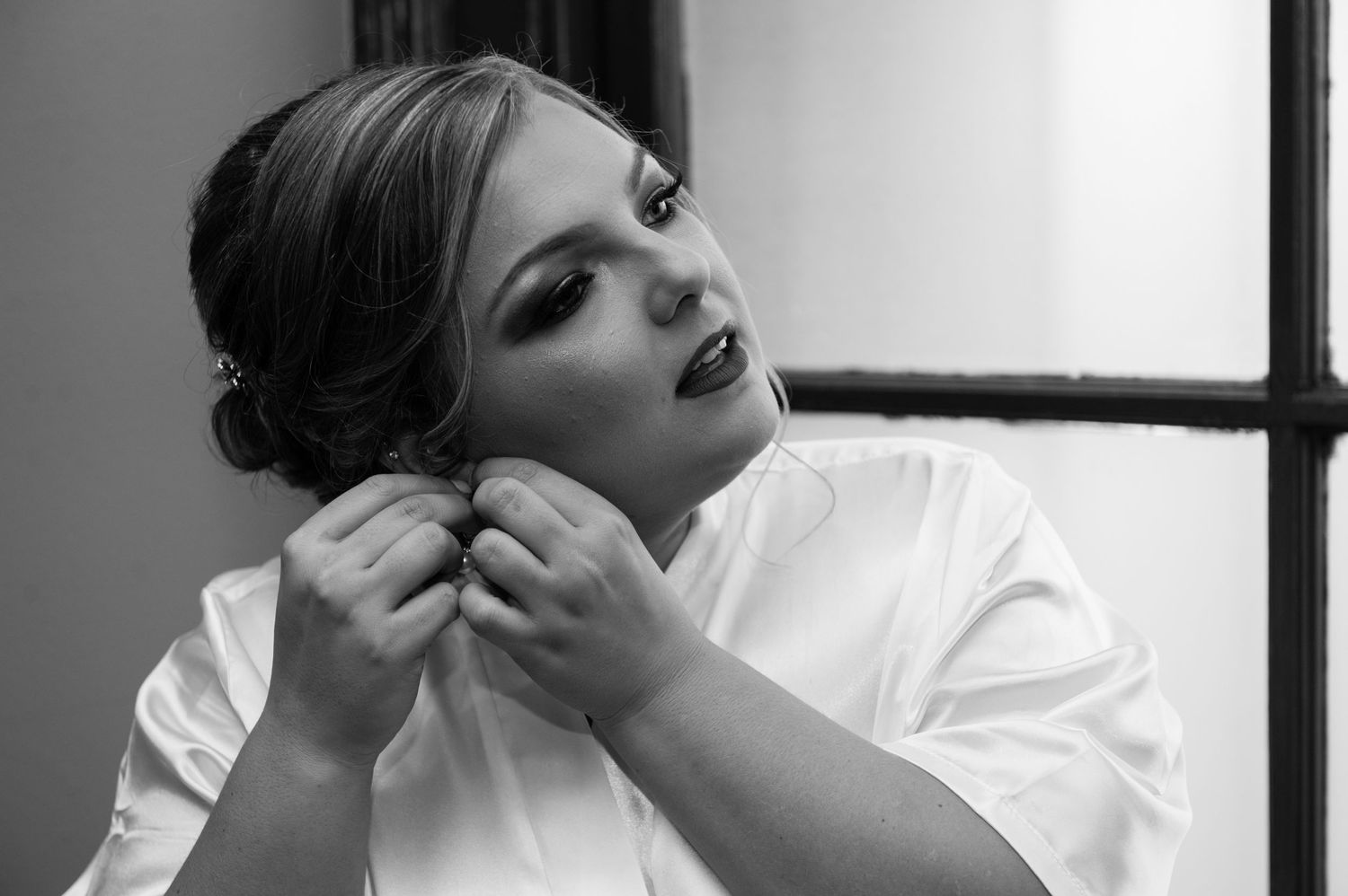 Artistic black and white shots of wedding day preparation moments.