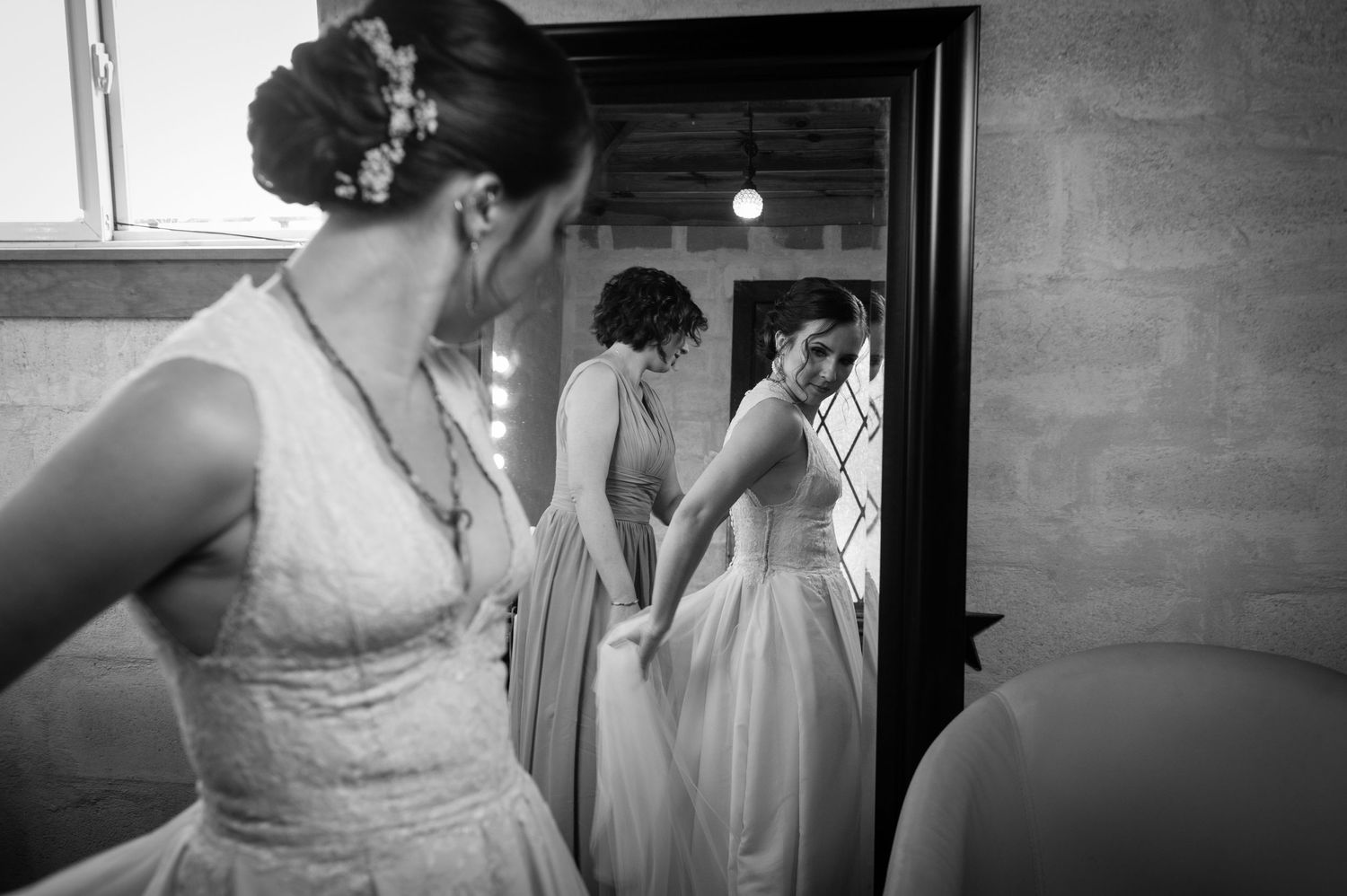 A black and white photo collage showing intimate moments of a bride preparing for her wedding ceremony.