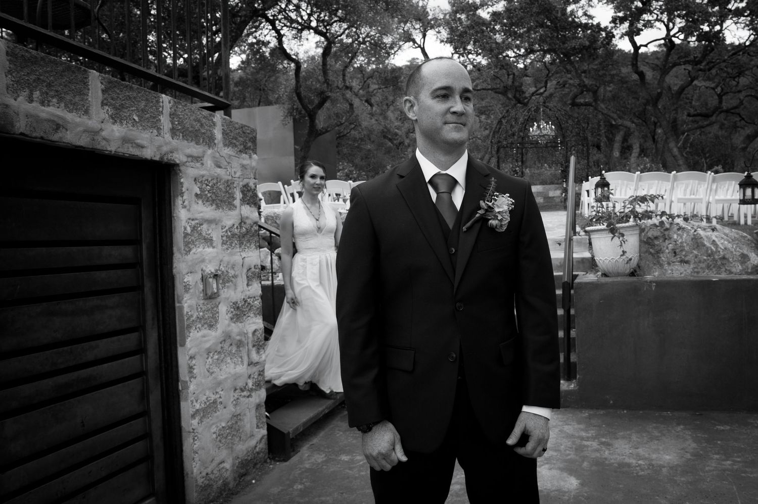 Black and white wedding photos displayed in a filmstrip style sequence showing outdoor ceremony moments.