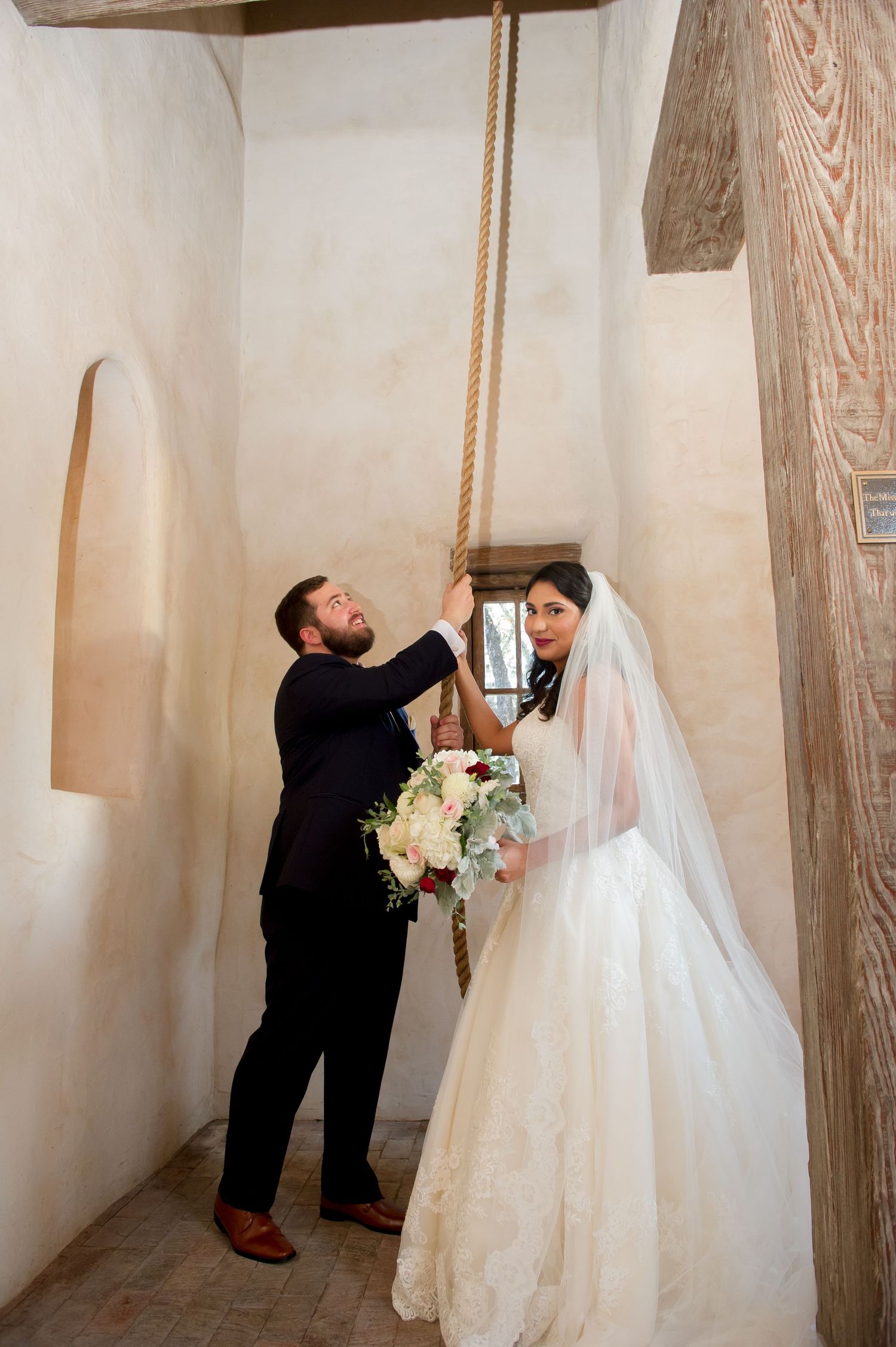 Candid wedding photo sequence showing playful moments between couple in white church interior.