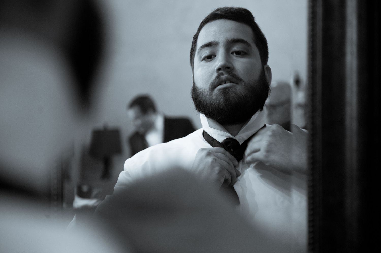 Black and white portrait series showing intimate wedding day moments.