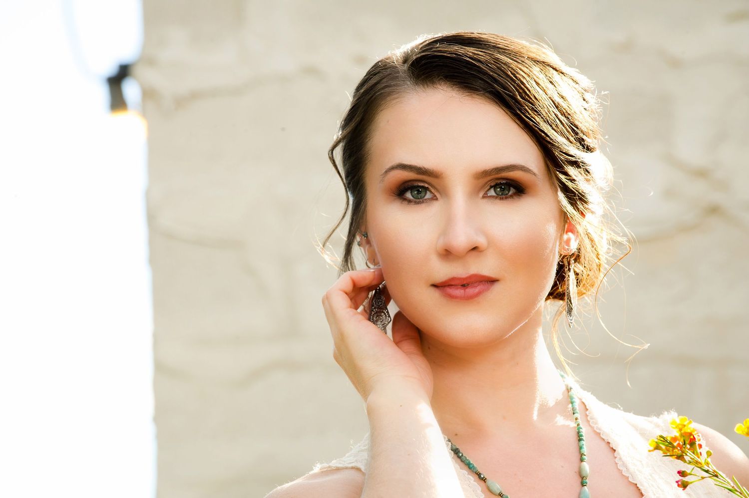 Natural light portrait session in an elegant outdoor setting.