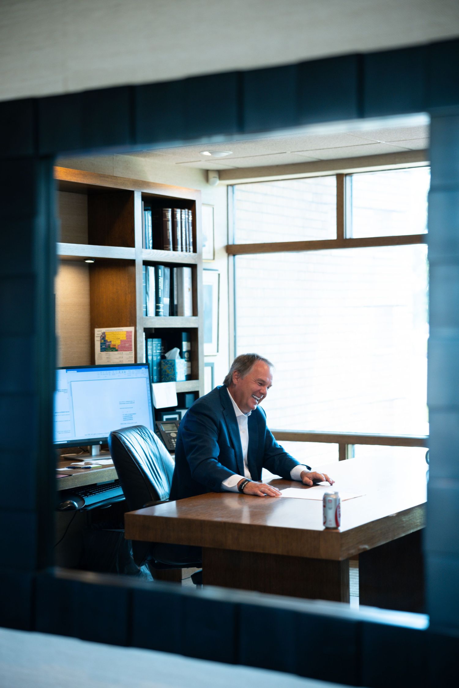 image of man in suit working at his desk in hutchinson ks