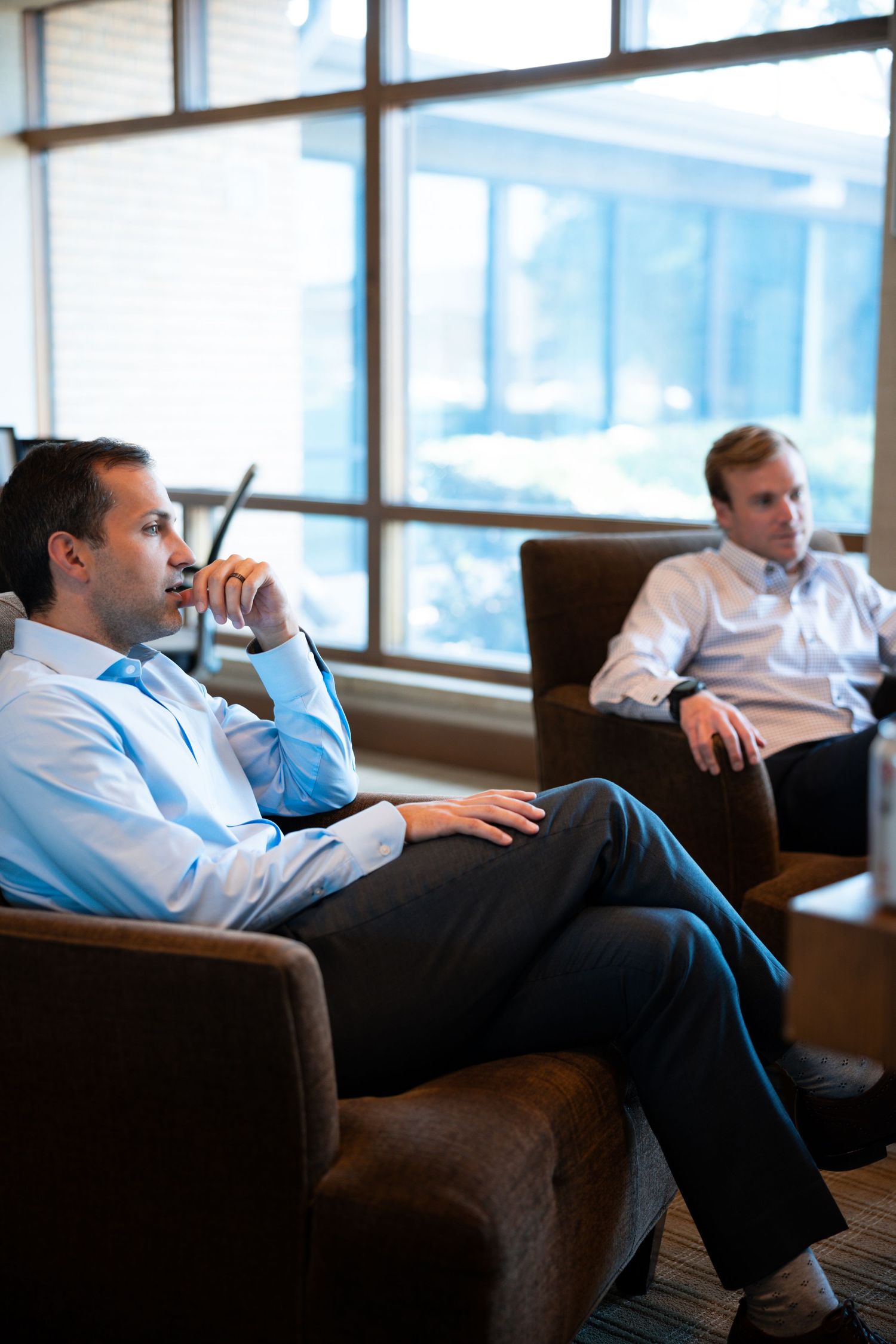 image of men discussing in an office