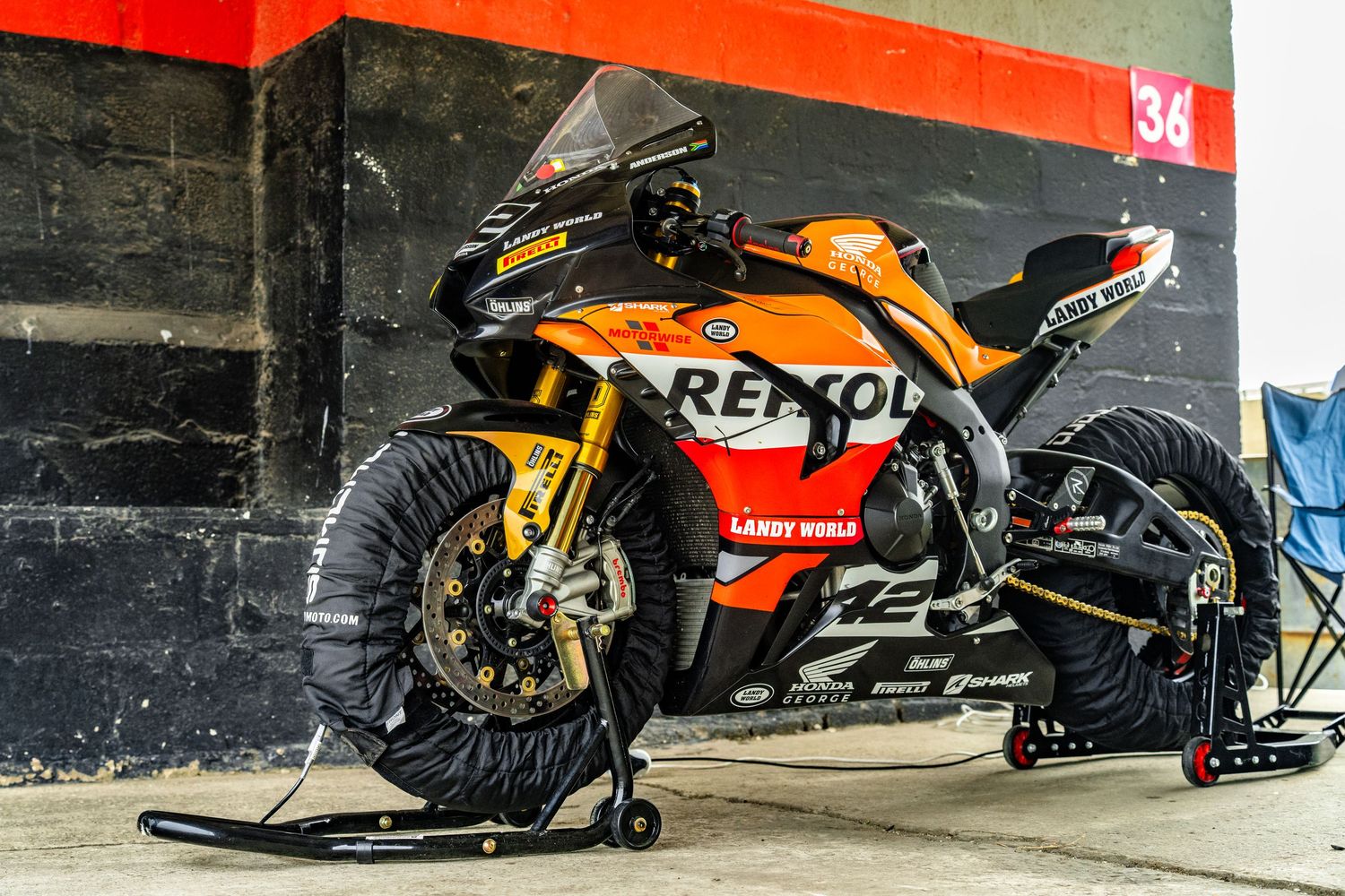 Racing motorcycle prepared in the pit lane during a track day