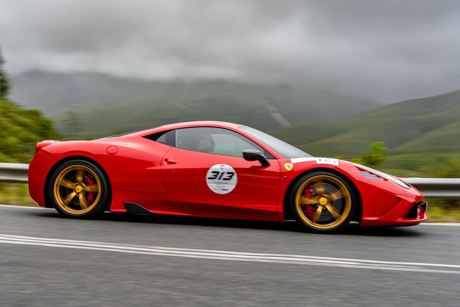 Red Ferrari driving along the Robertson mountain pass in South Africa