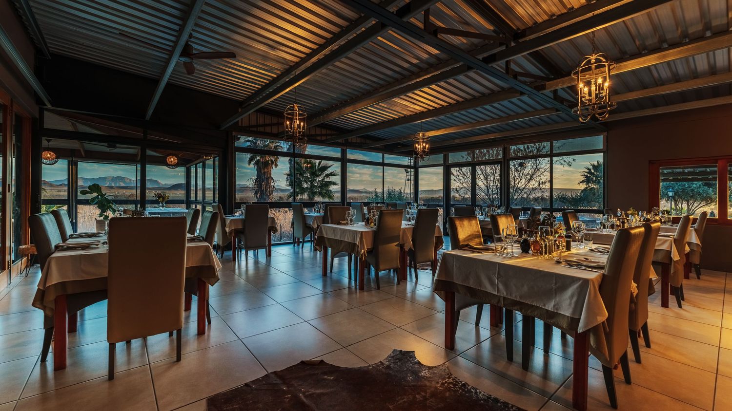 A restaurant interior at sunset
