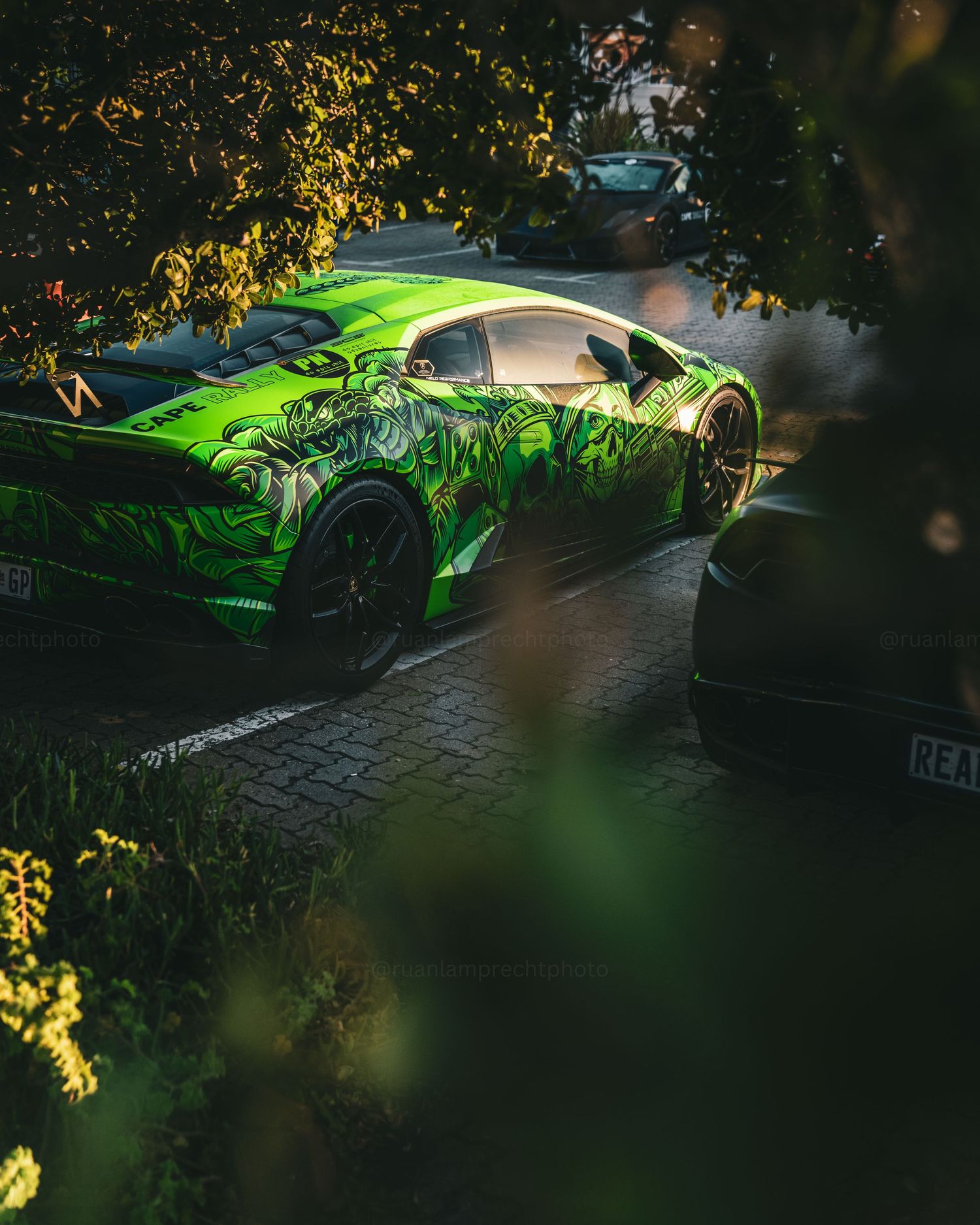 A Lamborghini parked along other supercars