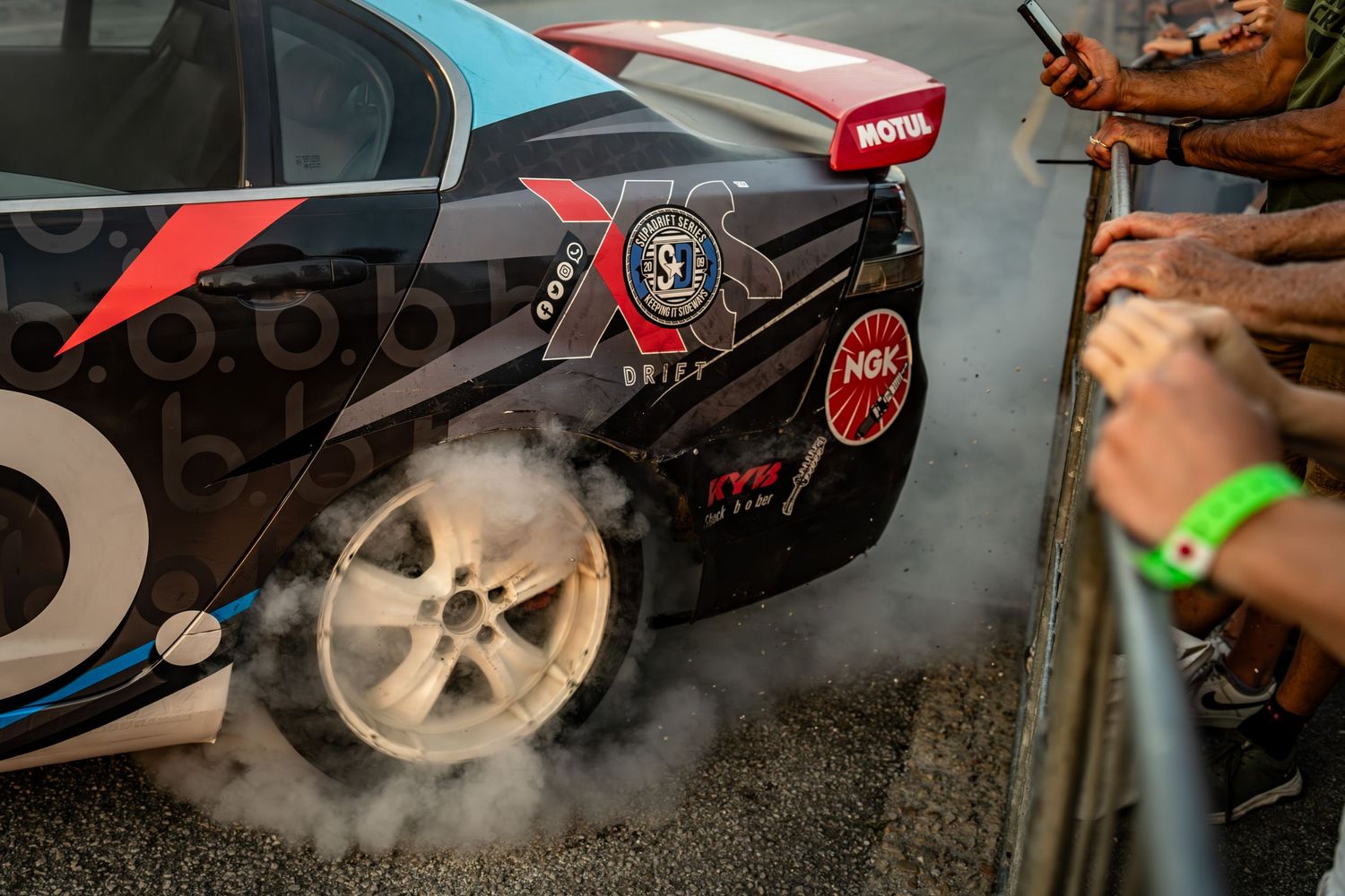 Close-up of a race car tire smoking during a motorsport event