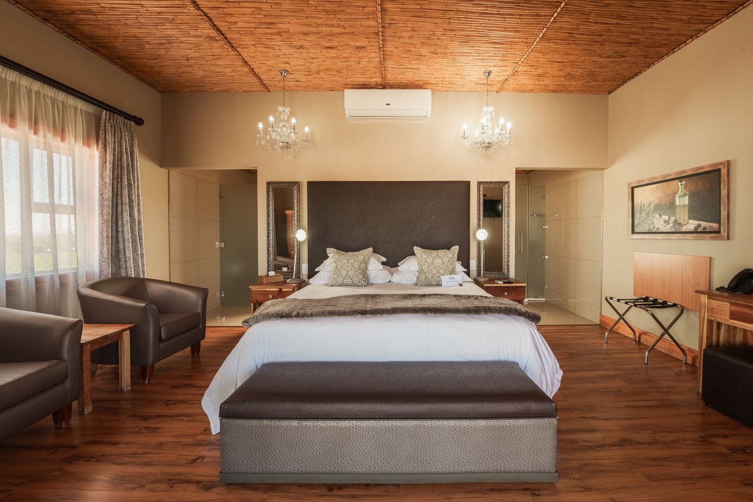 Luxurious bedroom interior with wooden ceiling and modern furnishings.