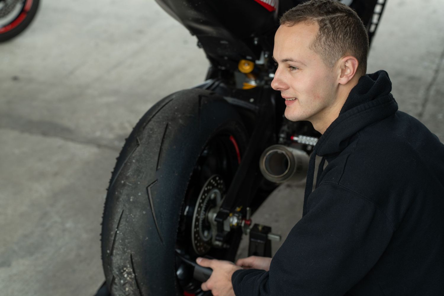 Motorcycle rider working on his motorbik