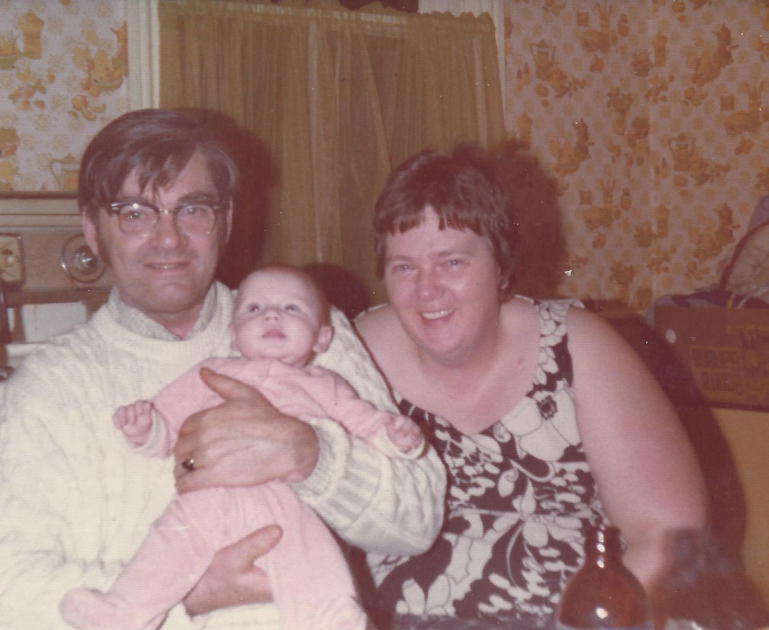 A  vintage family photograph from the 1975 showing tender moments--Alexis Anne Photography