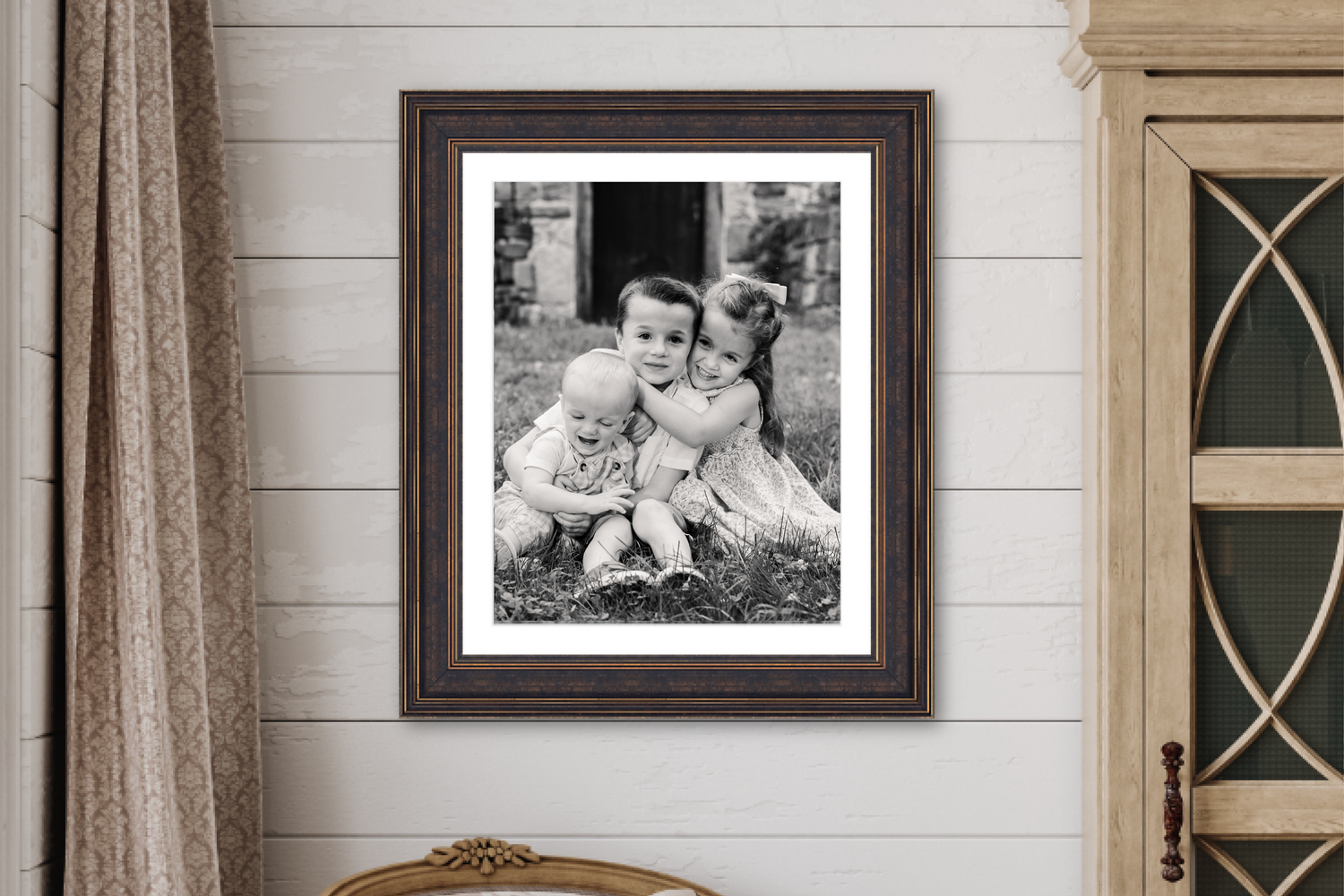 Framed fine art portrait of children captured at a private luxury venue.