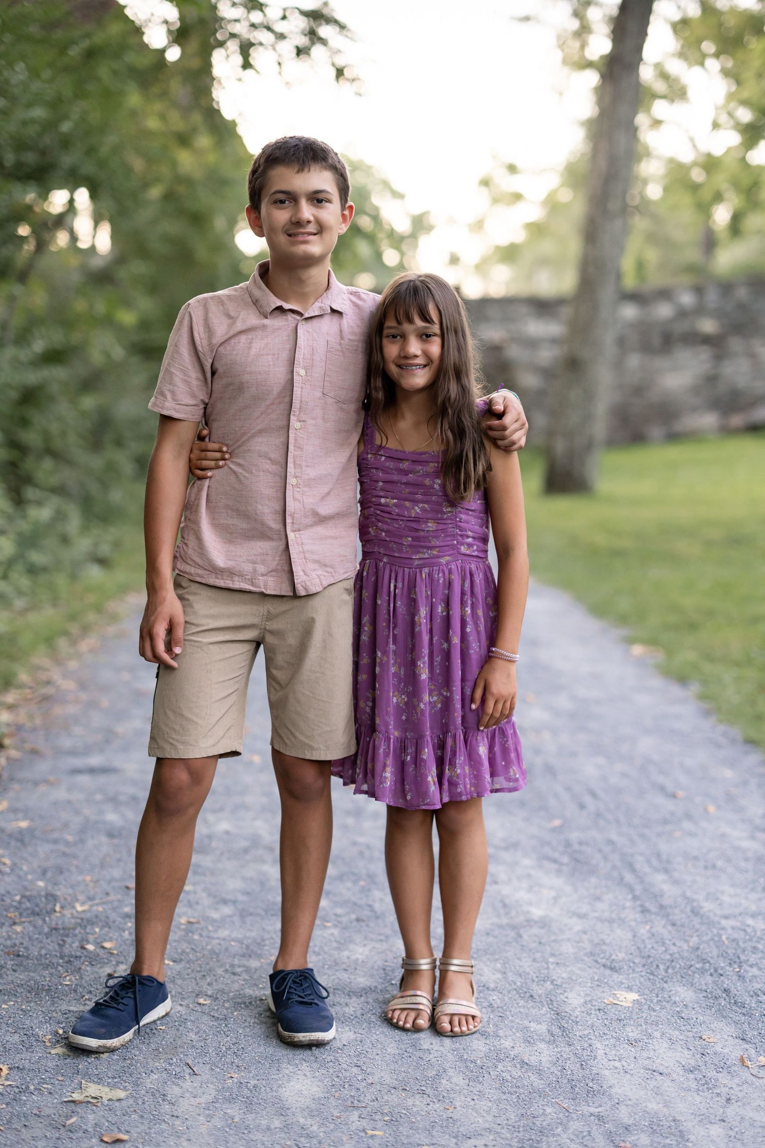 Two siblings pose for a traditional portrait at Grings MIll in Reading PA, luxury full family sessions by Megan Mariah Photography