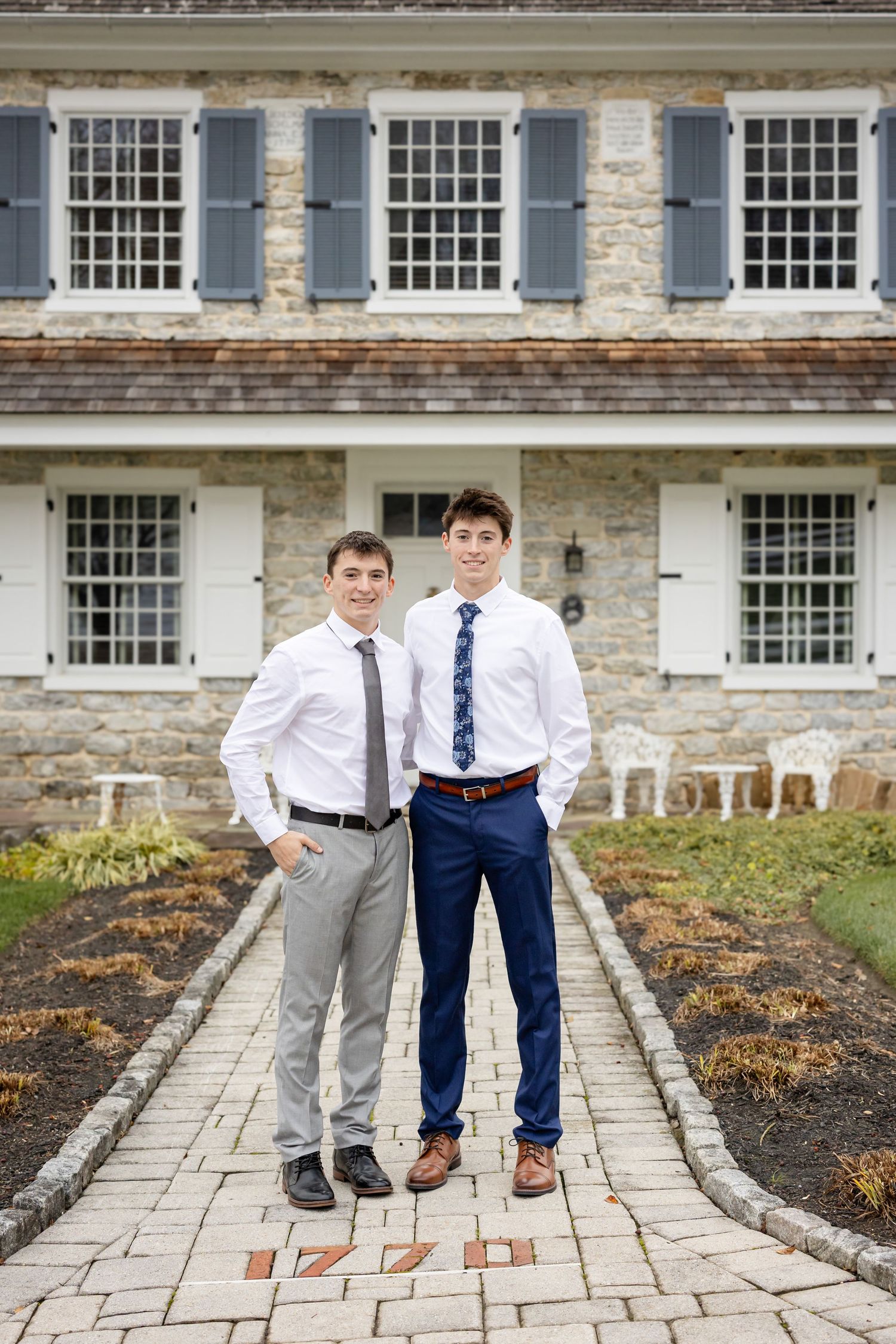 Candid portrait of senior brothers emphasizing movement and authenticity