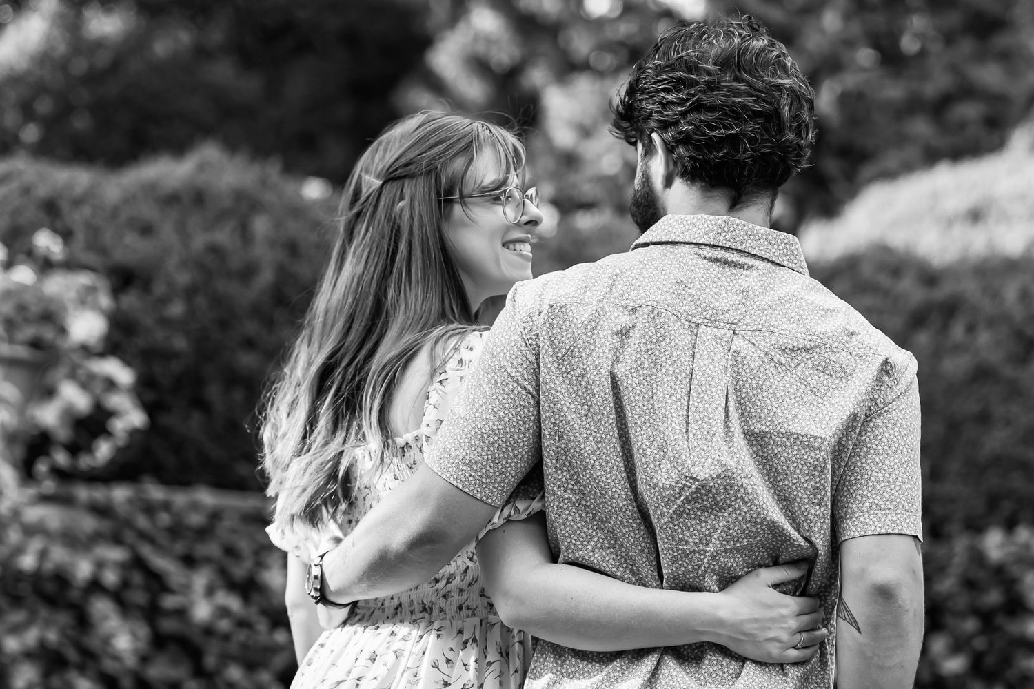 High end black and white portrait of a young couple engaged in a candid moment at a luxury venue in Lancaster, PA.