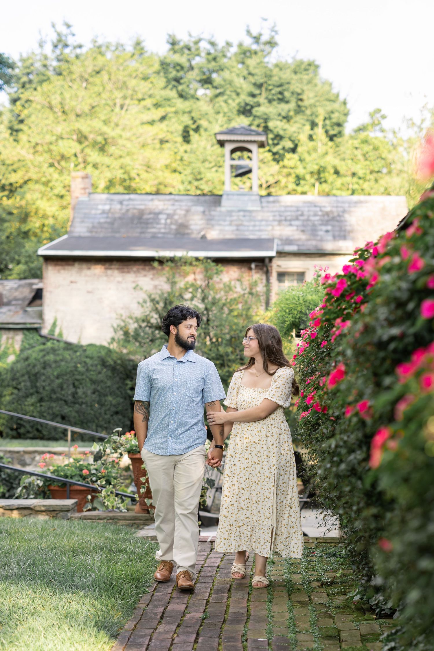 A husband and wife look lovingly at one another during candid family photos in a luxury Lancaster, PA venue.