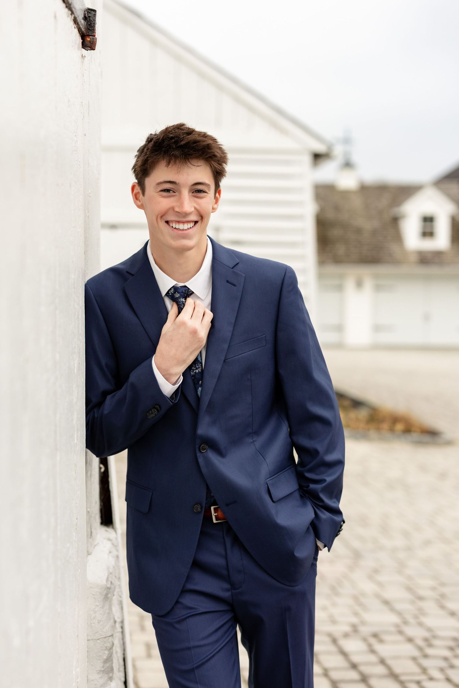 Senior boy styled in an upscale indigo suit, posed at a luxury venue in Lancaster, PA | upscale senior portraits | Megan Mariah Photography