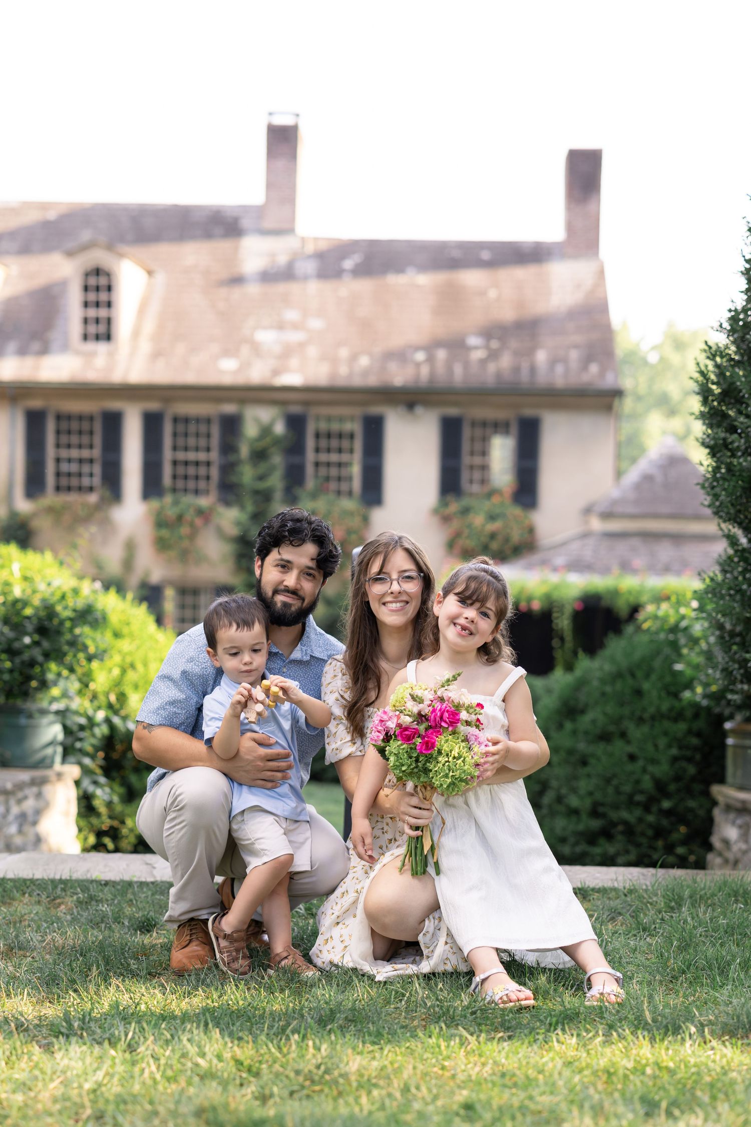 Elegant posed family portrait at Conestoga House and Gardens in Lancaster, capturing connection and timeless, luxury-style imagery