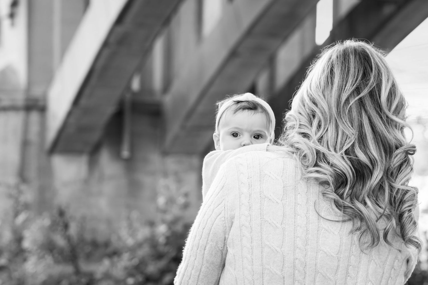 Tender outdoor portrait session in soft natural lighting with gentle embraces.