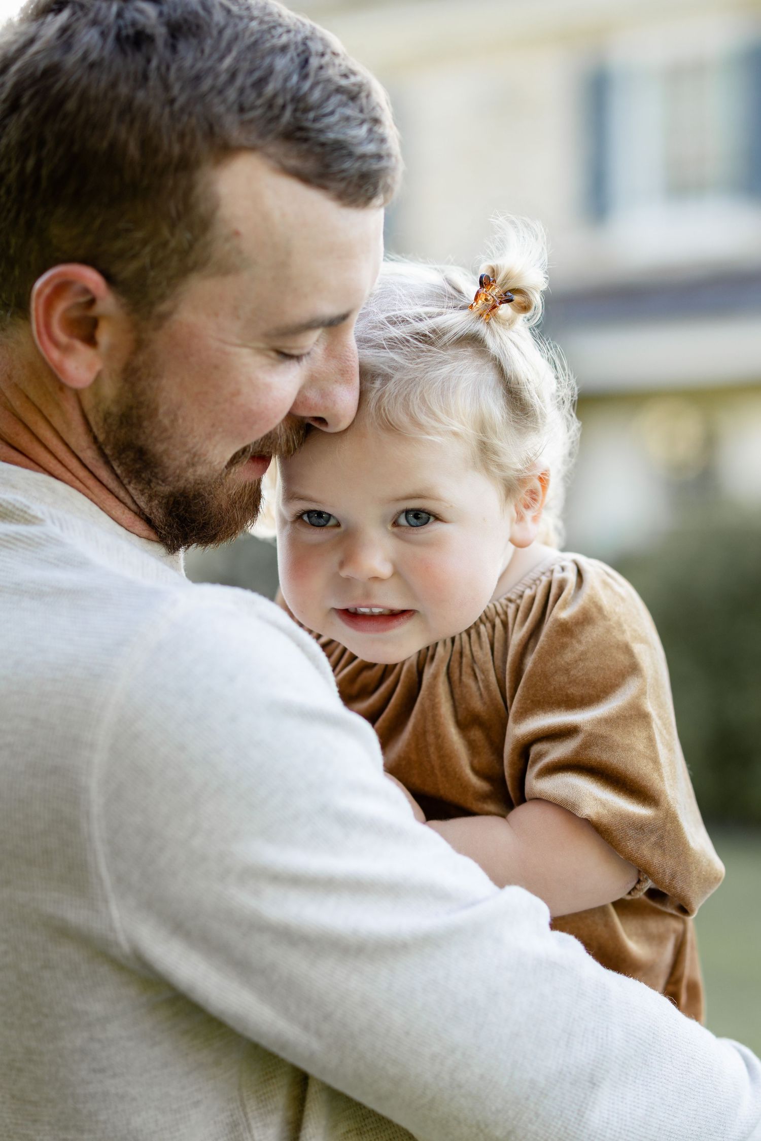 Premium portraits by Megan Mariah Photography | A sweet moment between father and young daughter.