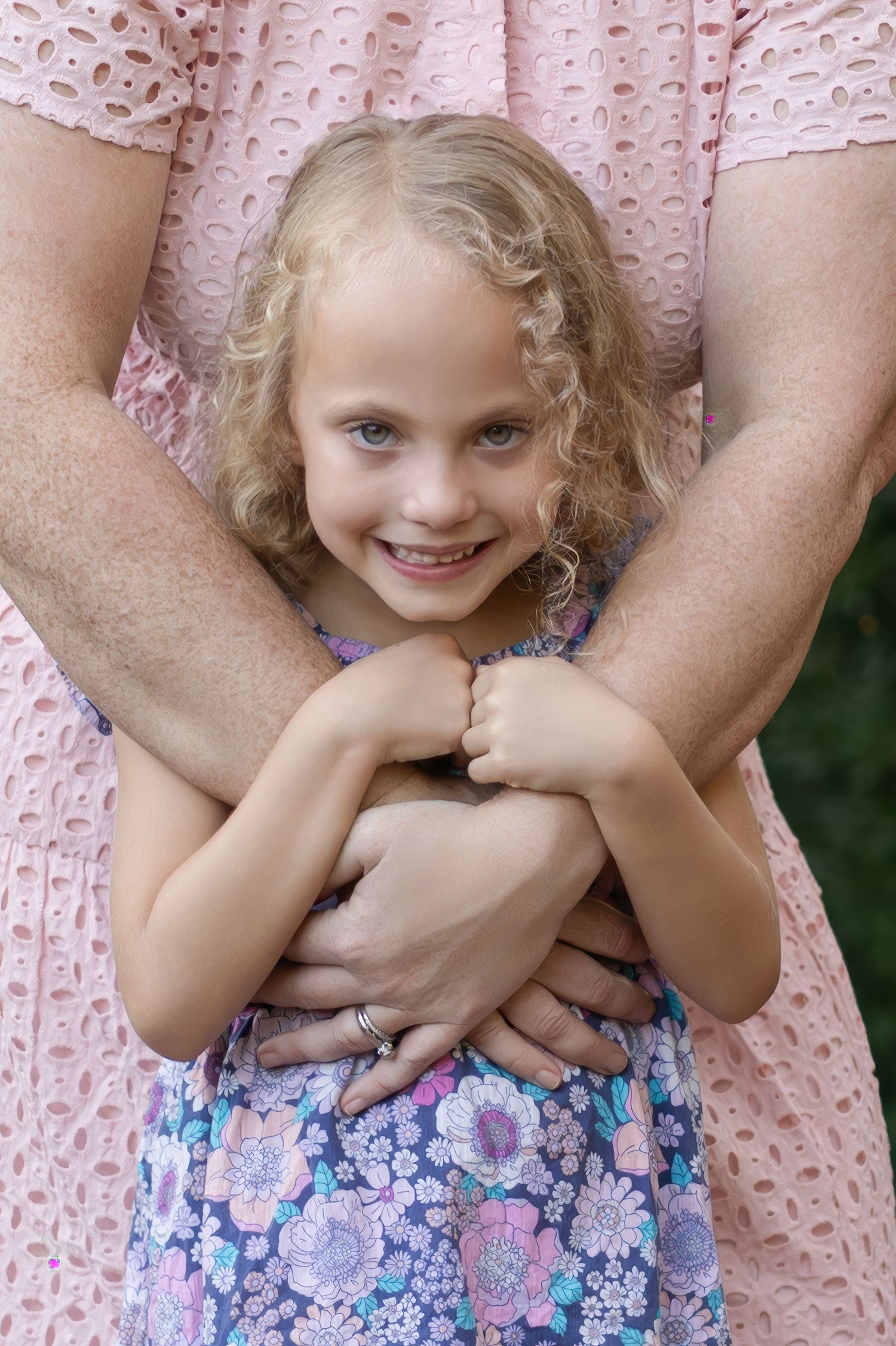 A high-end Lancaster, PA family photographer captures a sweet embrace between mother and child.