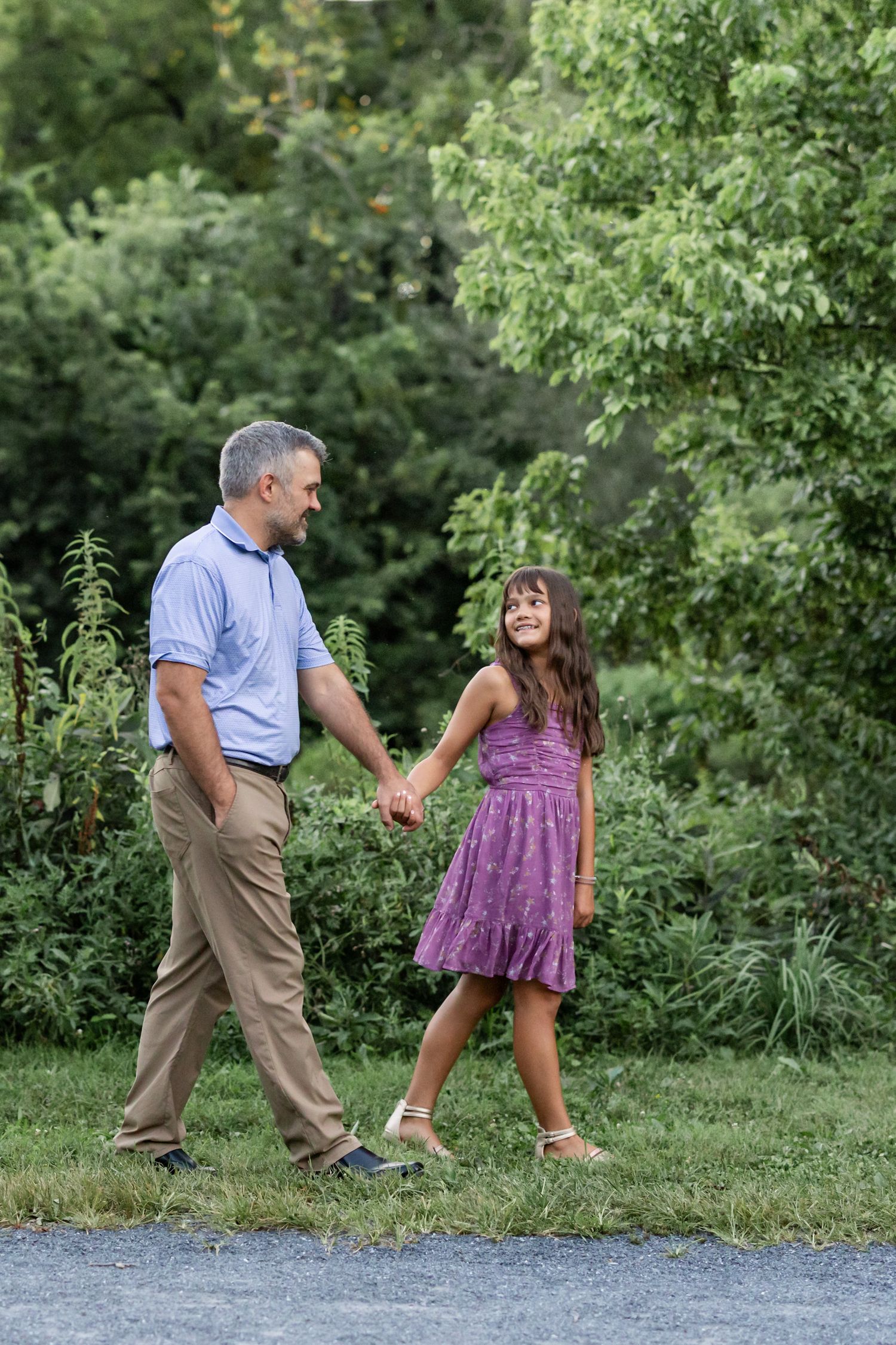 Father and daughter stroll at Grings Mill in Reading PA, a candid moment by Megan Mariah Photography