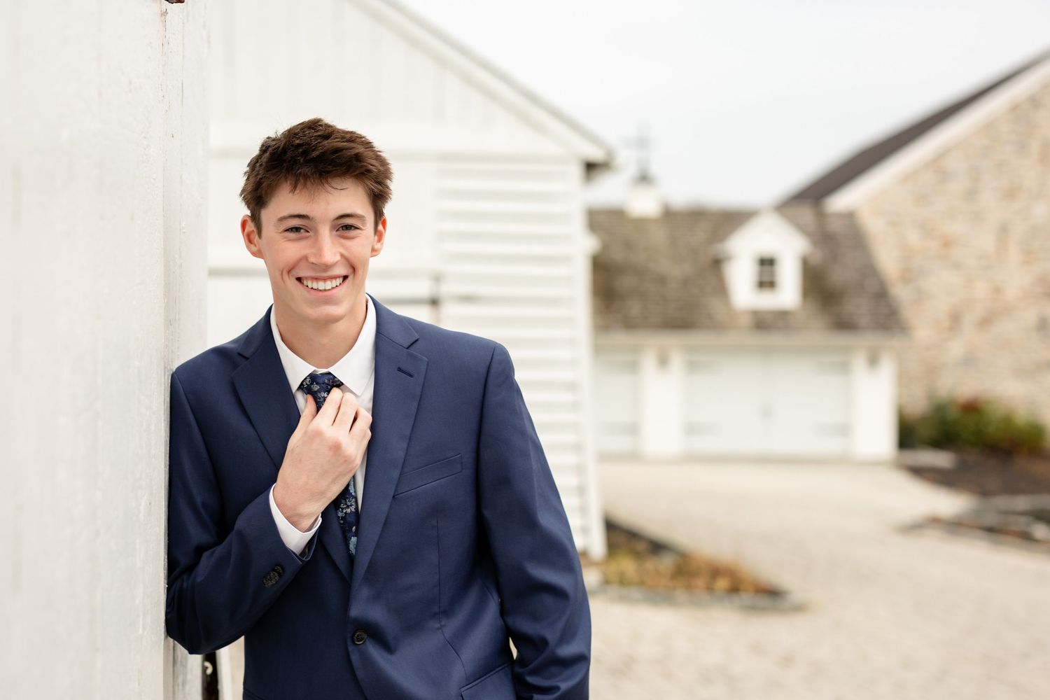 Senior portrait of a young man at Bluestone Estate, captured with refined, timeless style in a luxury setting