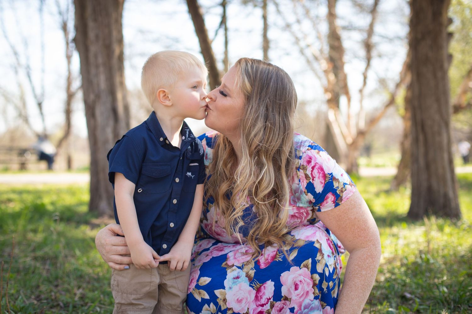 Mother and son portrait in shaded tree setting
