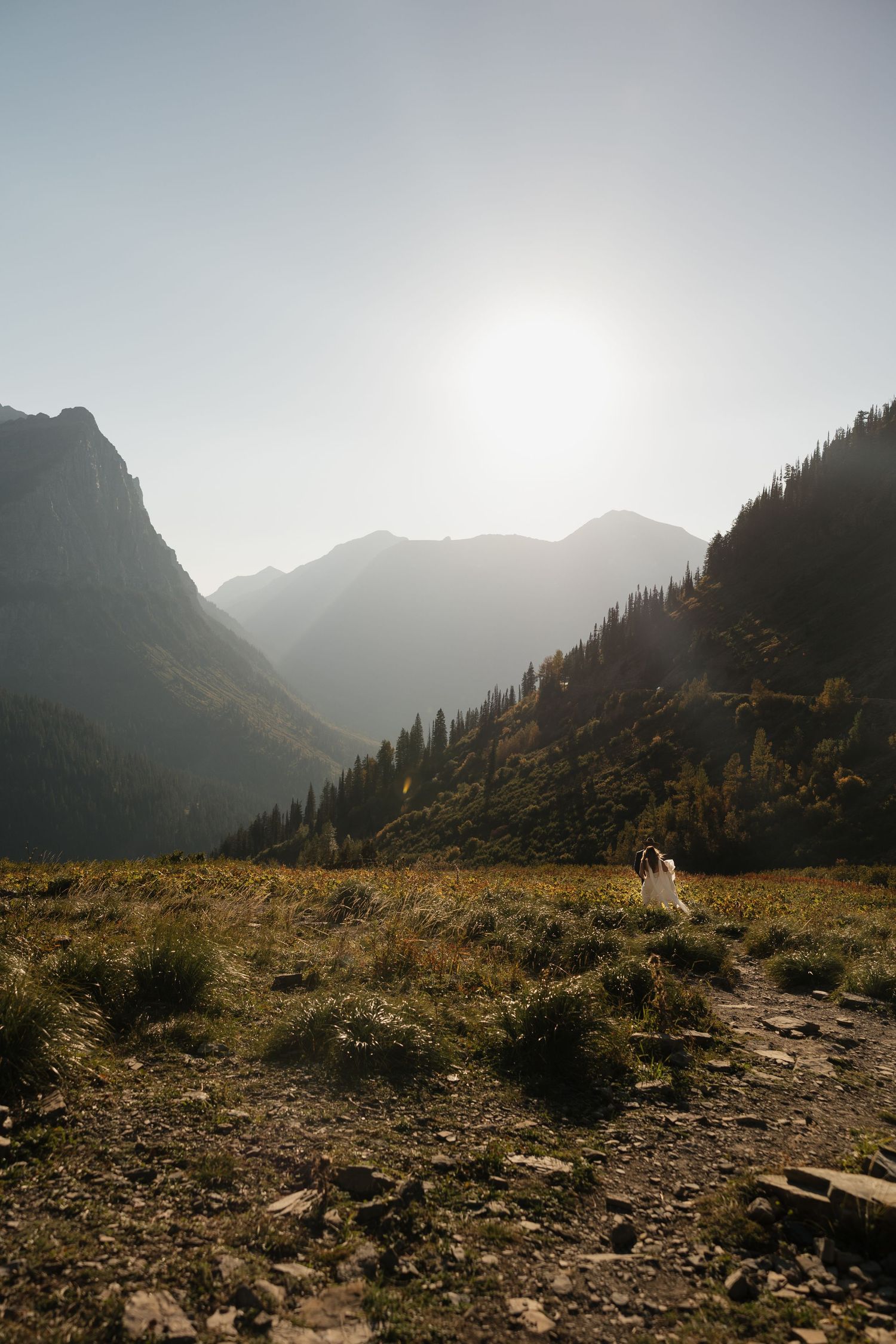 Majestic mountain landscape at sunset with rugged terrain and golden light.