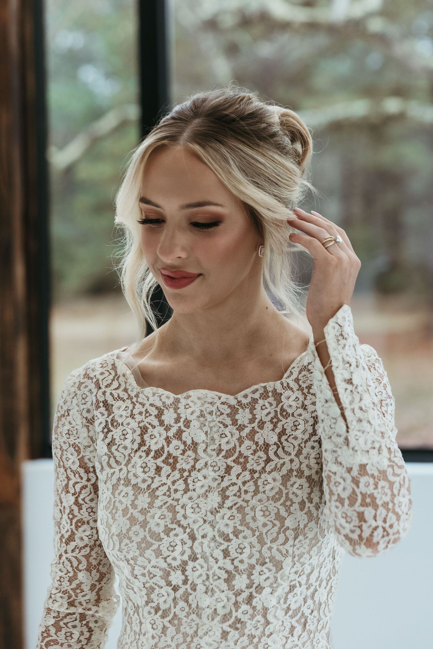 Beautiful lace long sleeve wedding dress with delicate floral details, featuring an elegant off-shoulder neckline.