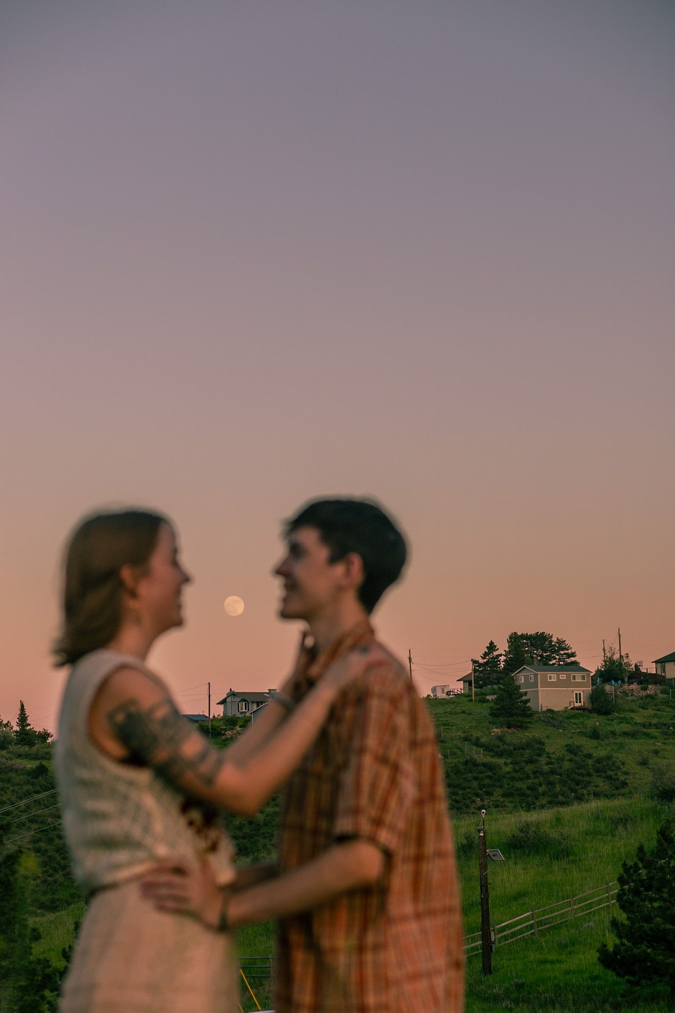 A couple with a mountainous backdrop in Fort Collins, Colorado.