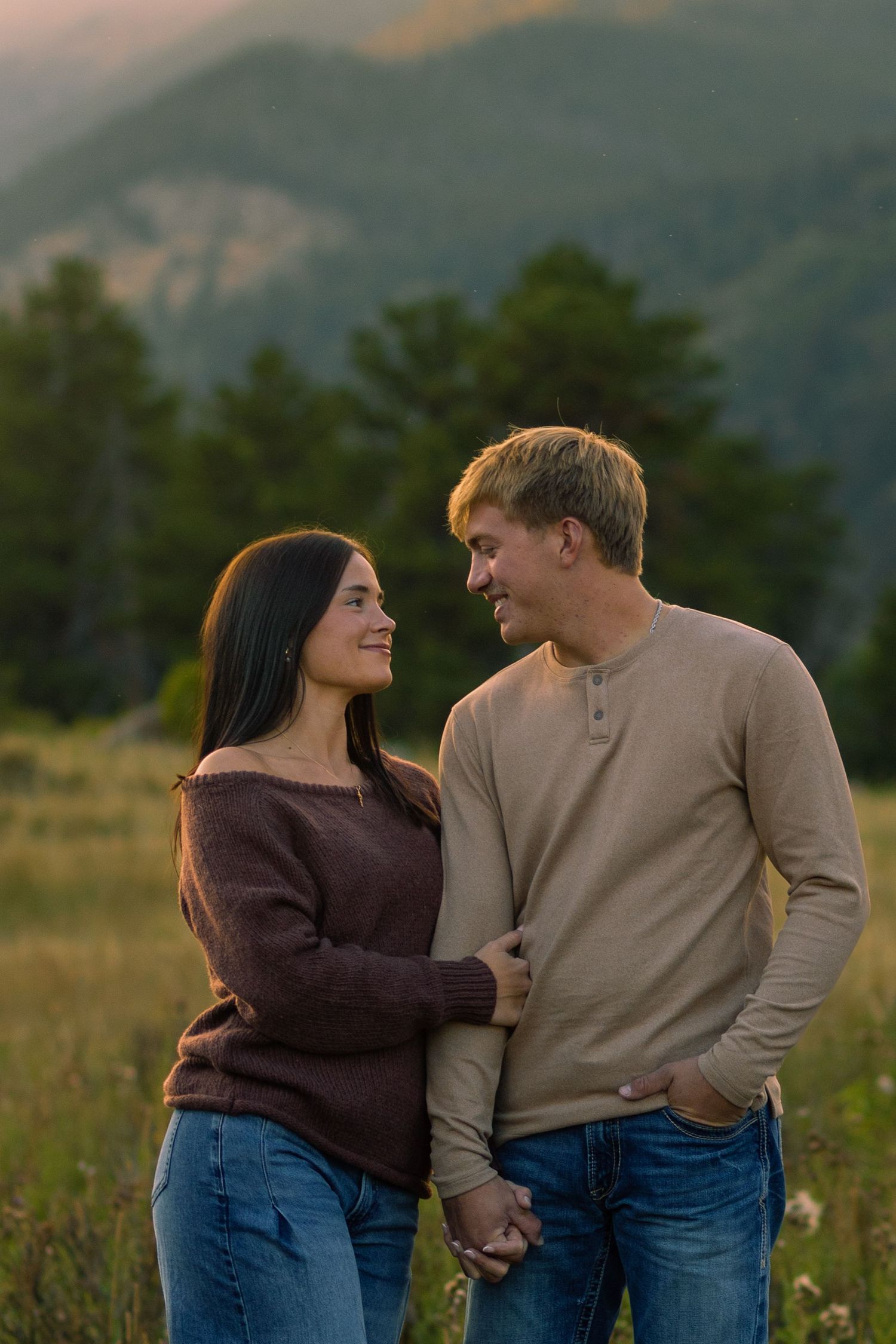 Candid moment captured between couple at romantic setting in Rocky Mountain National Park | Colorado