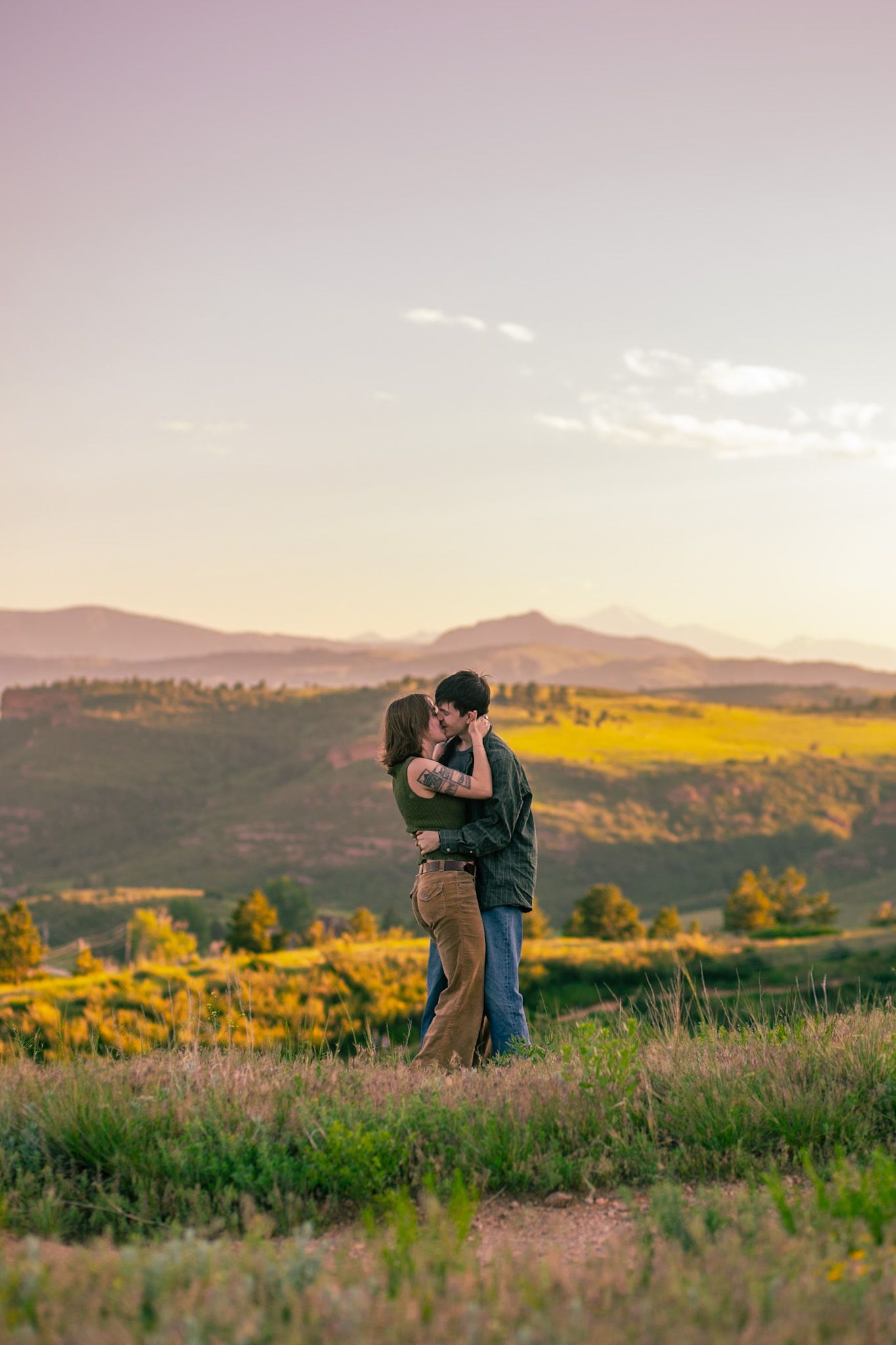 A couple with a mountainous backdrop in Fort Collins, Colorado.