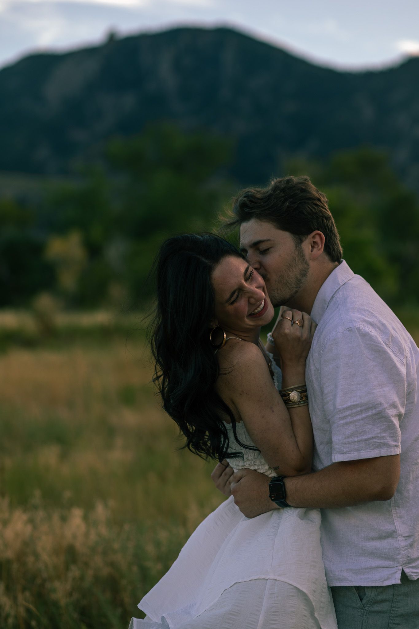 Candid moment captured between couple at romantic setting in Chautauqua Park | Colorado