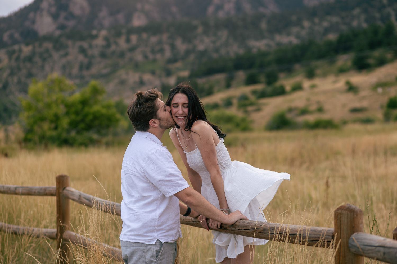 Candid moment captured between couple at romantic setting in Chautauqua Park | Colorado